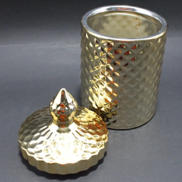 Jarrón decorativo dorado con tapa