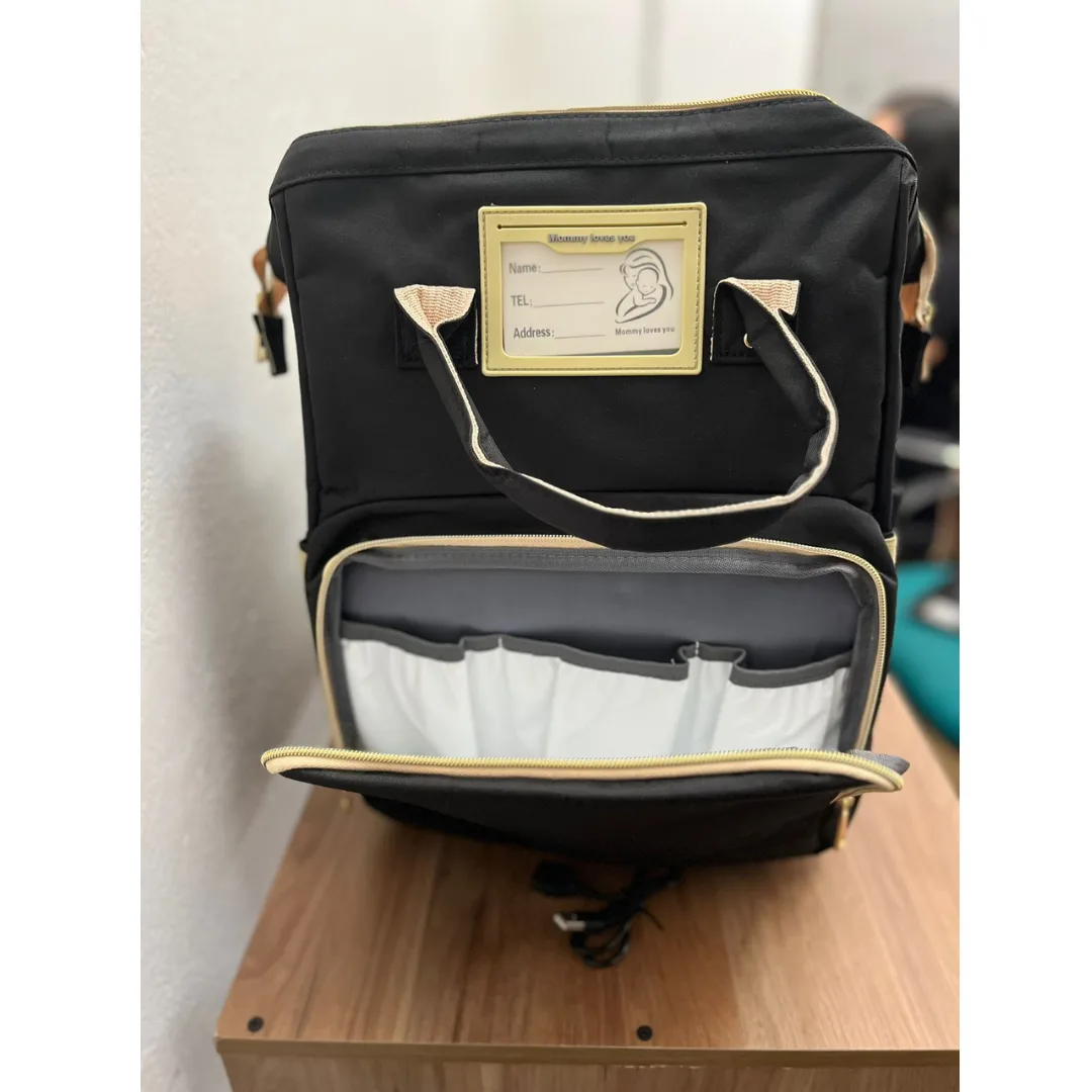 Morral pañalera con cuna plegable y cambiador